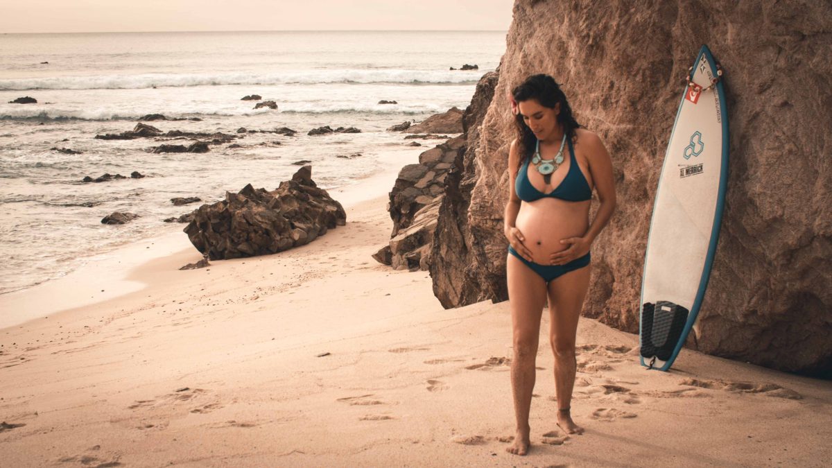Angie pregnant on the beach